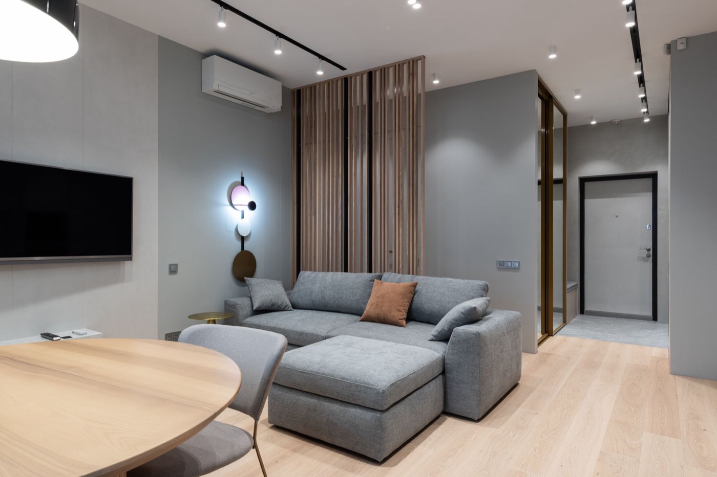 Wall-mounted air conditioning unit installed in a modern living room